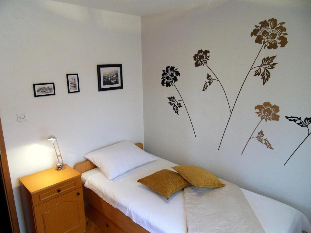 Posteľ alebo postele v izbe v ubytovaní Apartments Varos