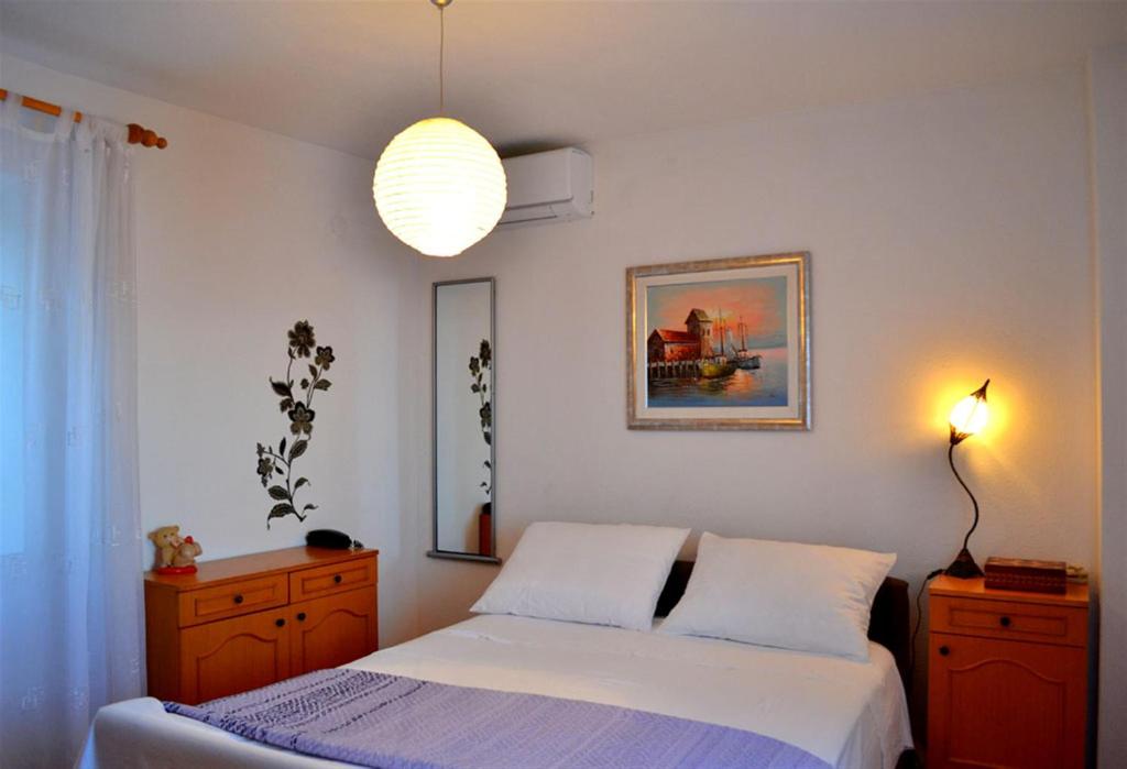 Posteľ alebo postele v izbe v ubytovaní Apartments Varos