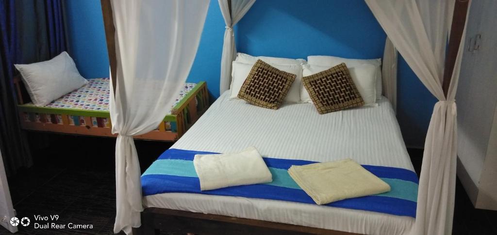 Postel nebo postele na pokoji v ubytování Serene Waters Homestay Goa