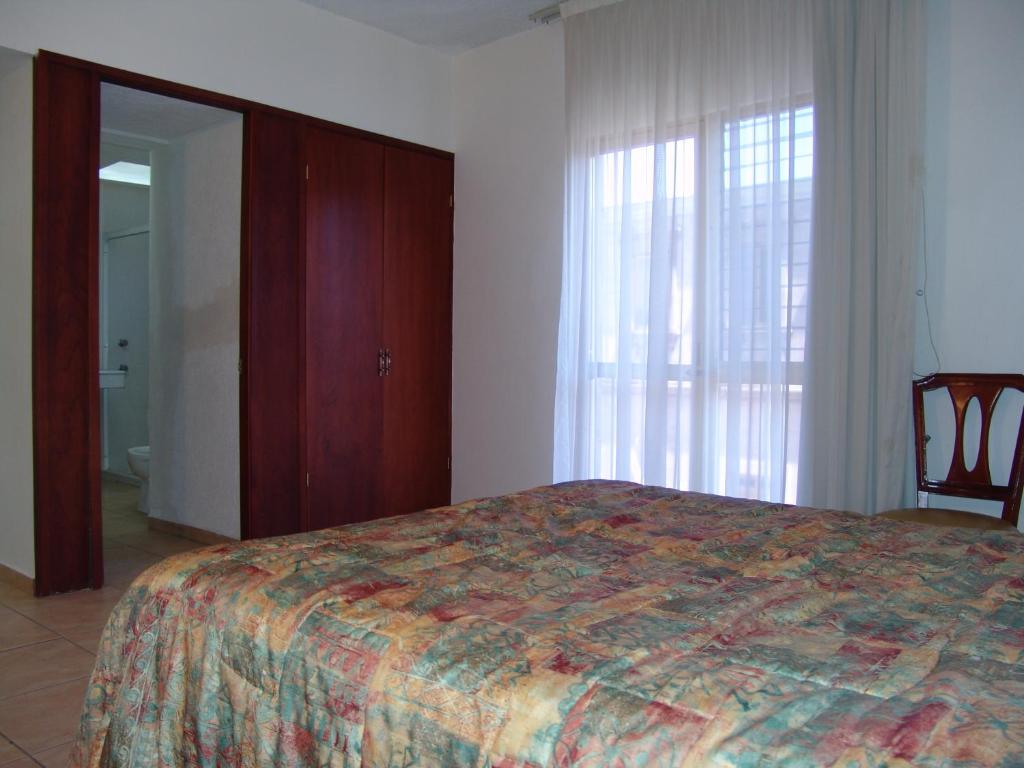 Postel nebo postele na pokoji v ubytování Hotel Posada Arcos