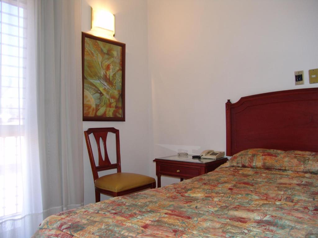 Postel nebo postele na pokoji v ubytování Hotel Posada Arcos