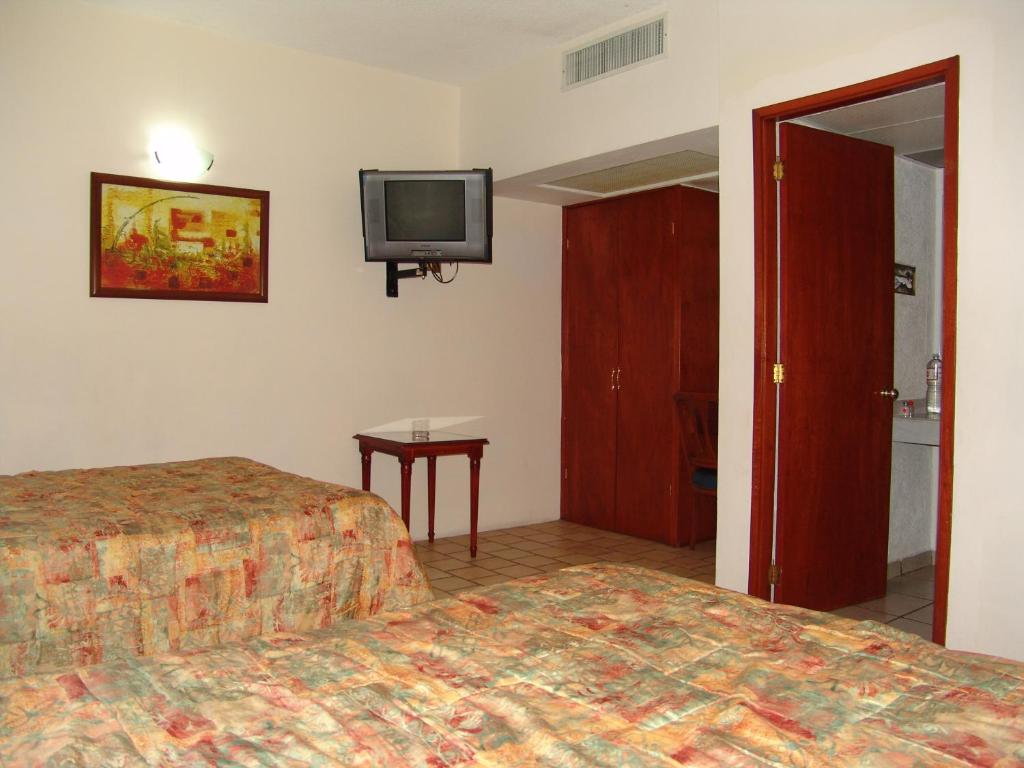 Postel nebo postele na pokoji v ubytování Hotel Posada Arcos