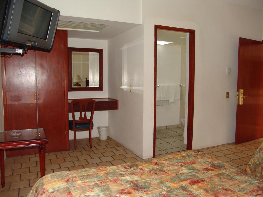 TV a/nebo společenská místnost v ubytování Hotel Posada Arcos