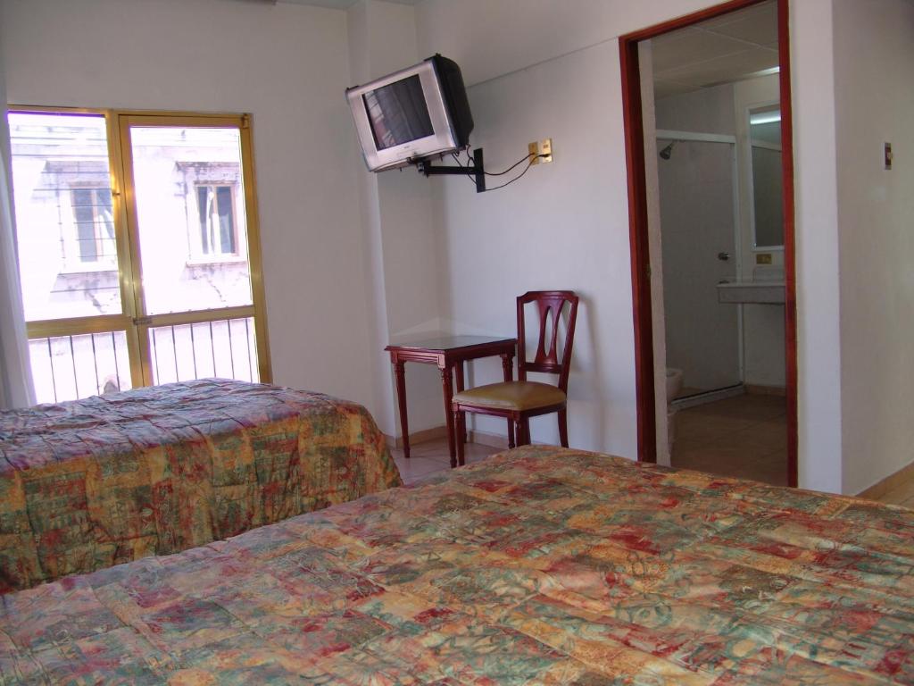 TV a/nebo společenská místnost v ubytování Hotel Posada Arcos