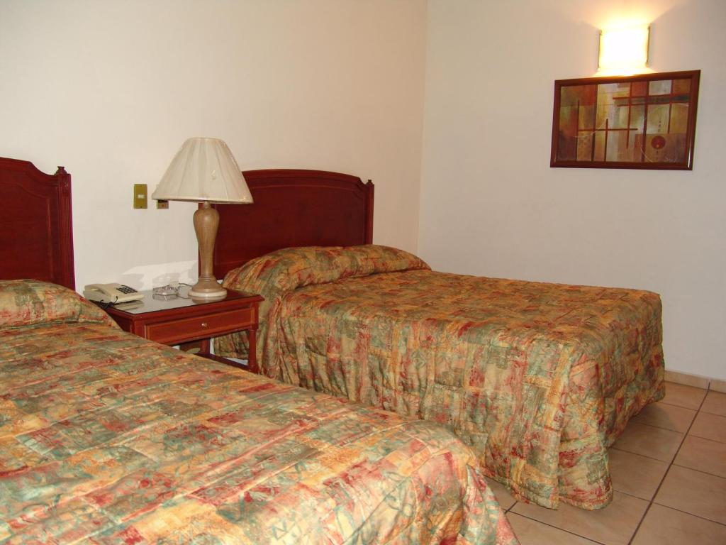 Postel nebo postele na pokoji v ubytování Hotel Posada Arcos
