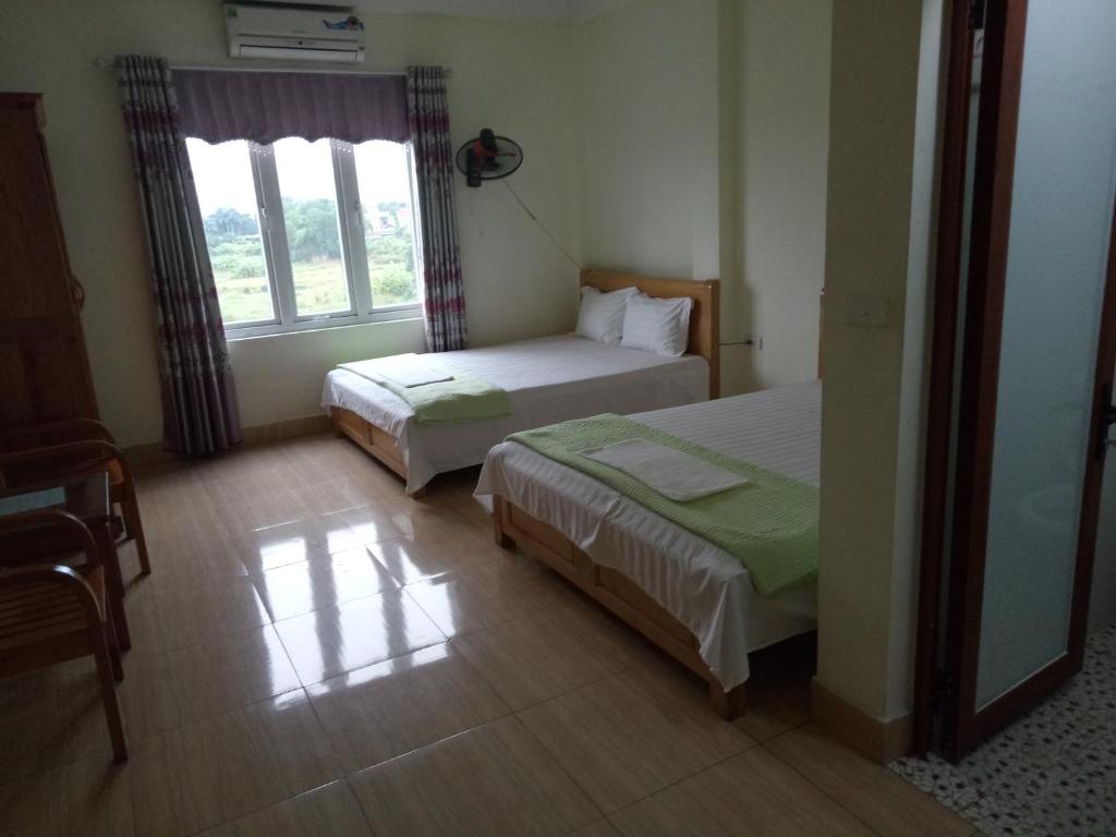 Postel nebo postele na pokoji v ubytování Nhà Nghỉ Diễm Quỳnh