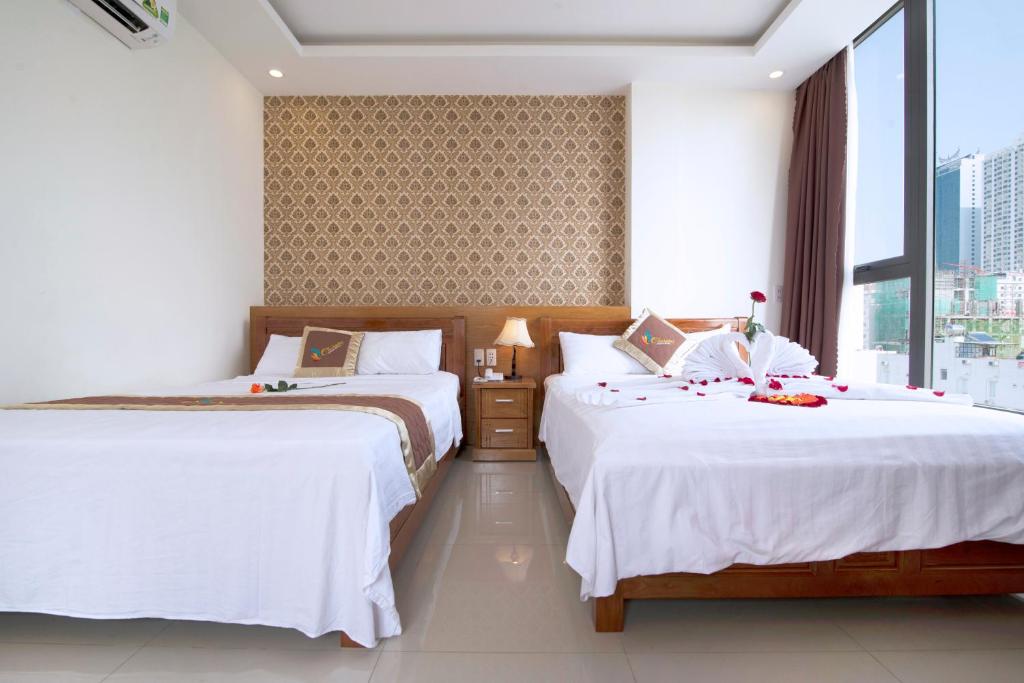 Postel nebo postele na pokoji v ubytování Charming Danang Hotel-203 Nguyễn Văn Thoại