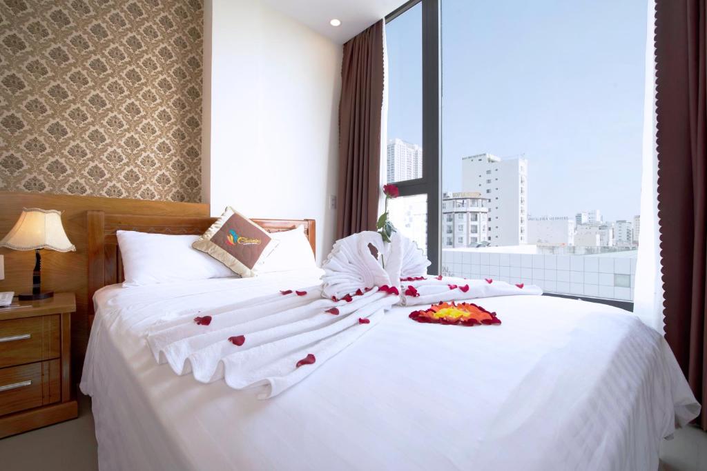 Postel nebo postele na pokoji v ubytování Charming Danang Hotel-203 Nguyễn Văn Thoại