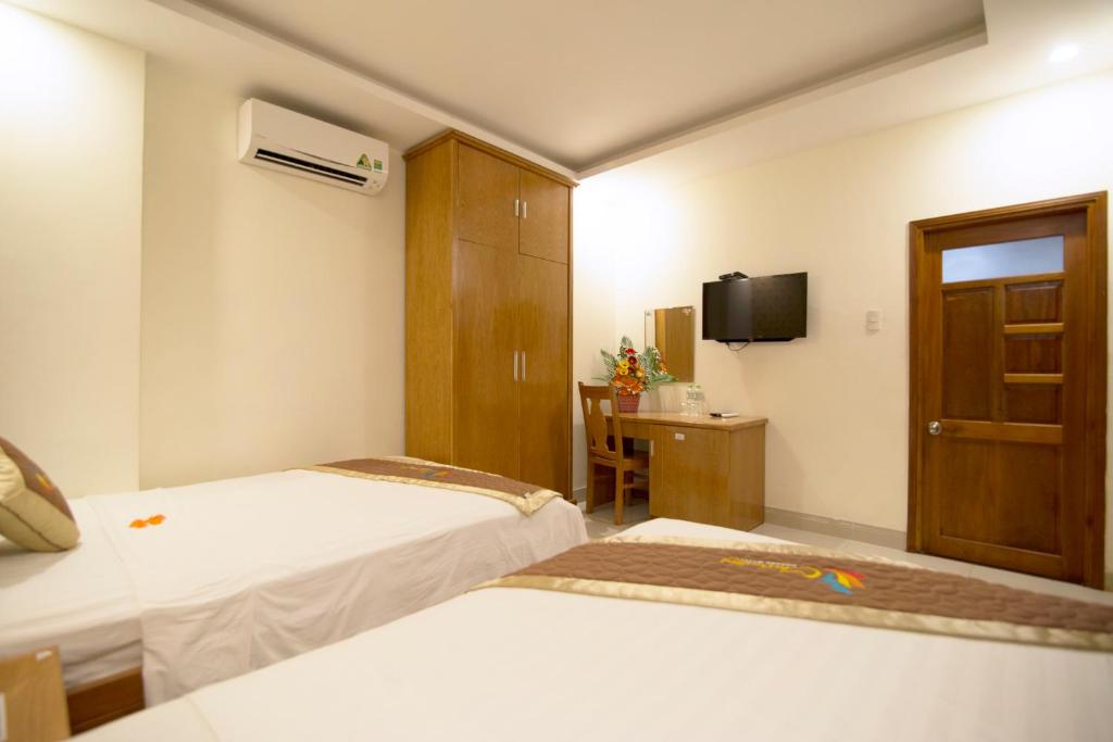 Postel nebo postele na pokoji v ubytování Charming Danang Hotel-203 Nguyễn Văn Thoại