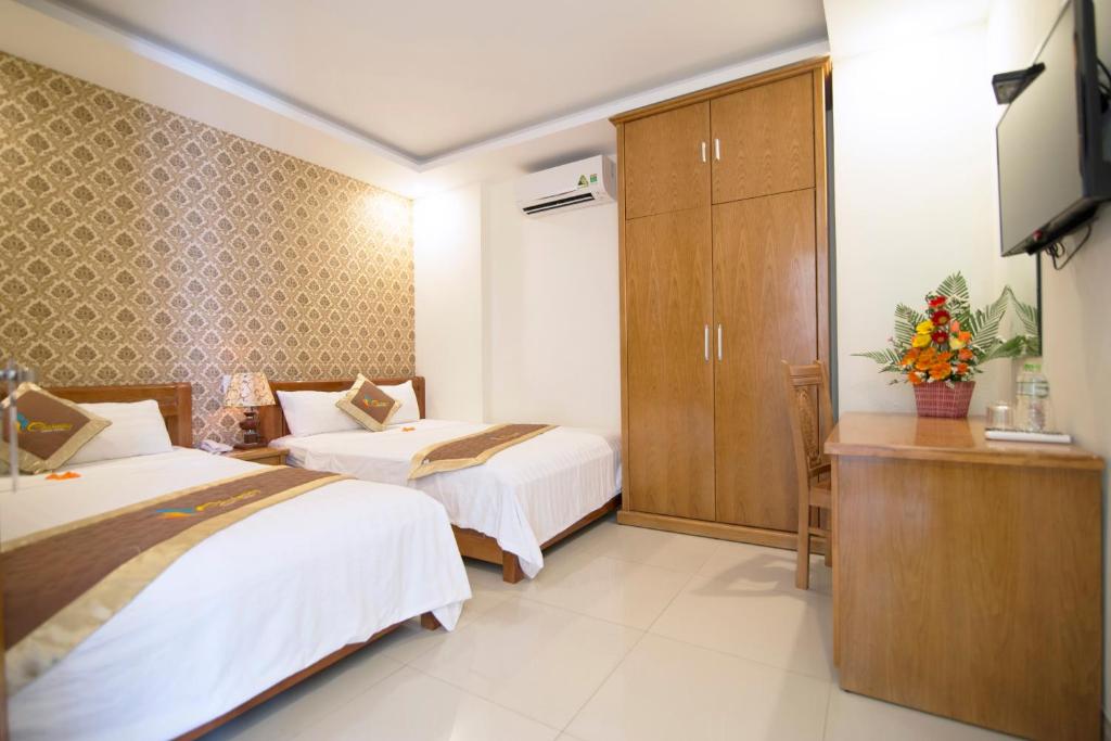 Postel nebo postele na pokoji v ubytování Charming Danang Hotel-203 Nguyễn Văn Thoại