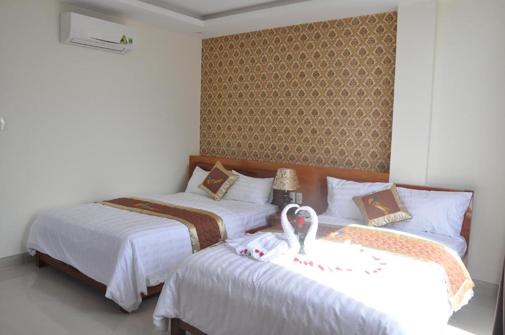 Postel nebo postele na pokoji v ubytování Charming Danang Hotel-203 Nguyễn Văn Thoại