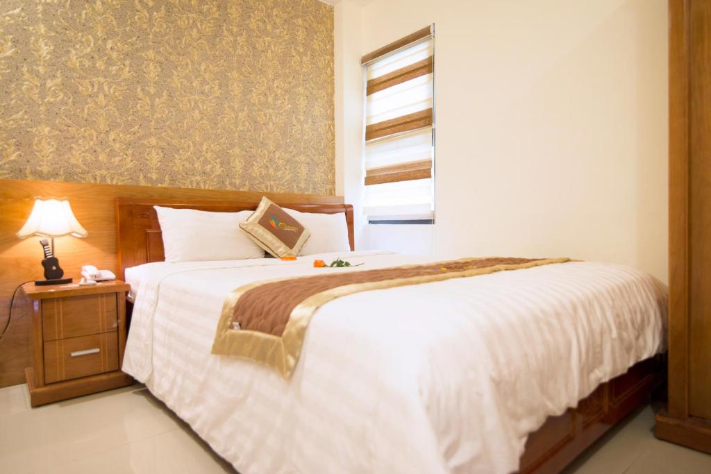 Postel nebo postele na pokoji v ubytování Charming Danang Hotel-203 Nguyễn Văn Thoại
