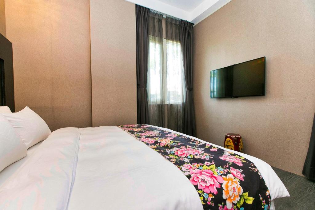 Postel nebo postele na pokoji v ubytování Pokara Resort