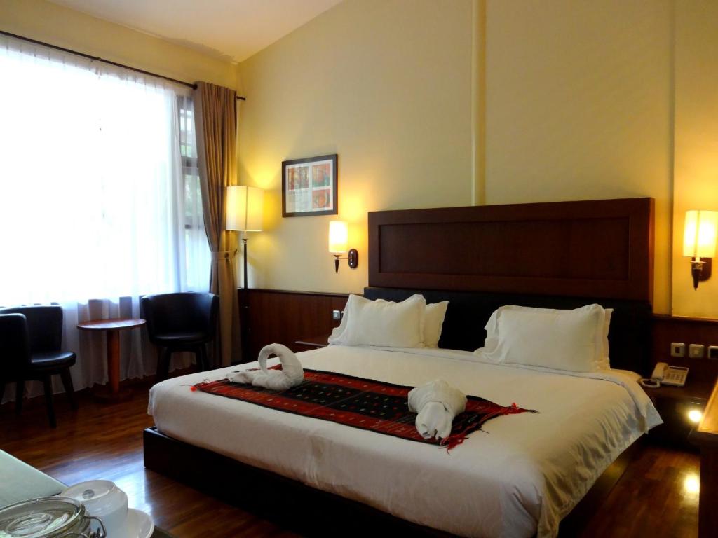 Postel nebo postele na pokoji v ubytování Taman Simalem Resort
