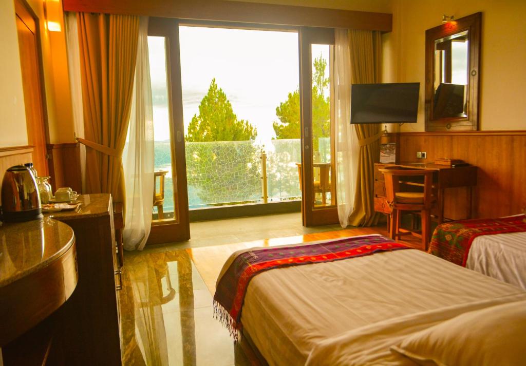 Postel nebo postele na pokoji v ubytování Taman Simalem Resort