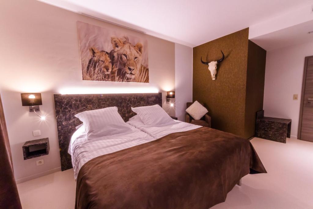 Postel nebo postele na pokoji v ubytování ManavaHotel