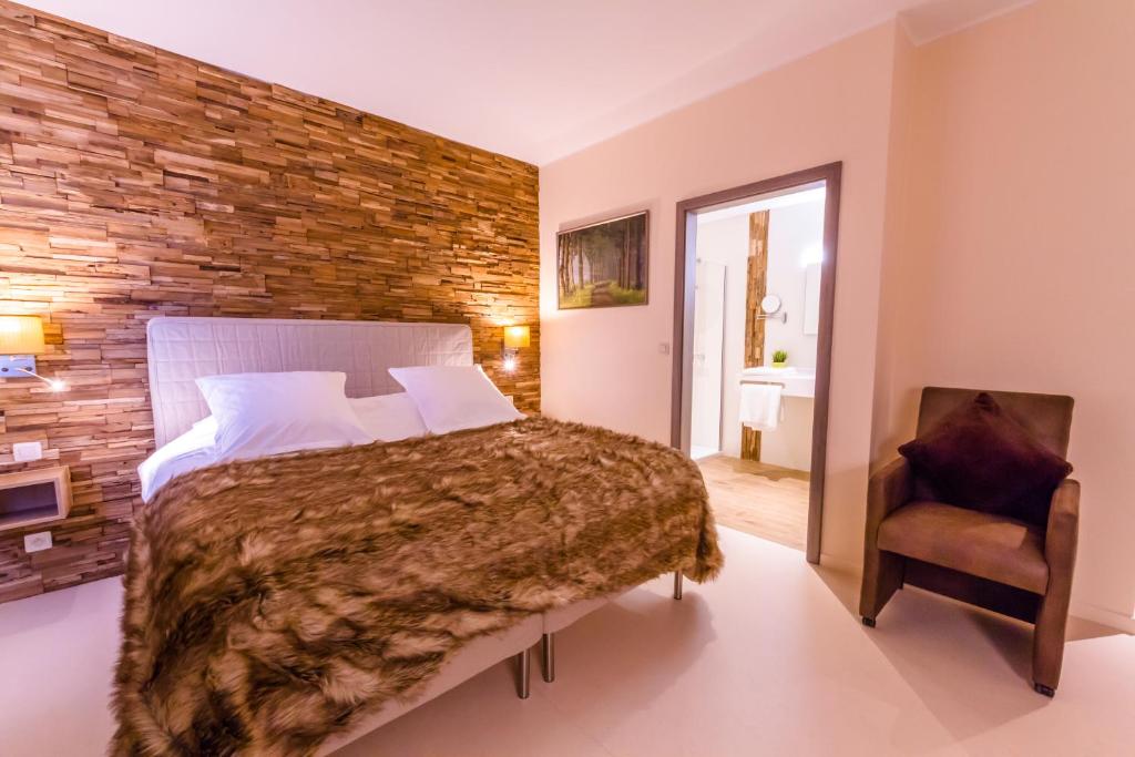 Postel nebo postele na pokoji v ubytování ManavaHotel
