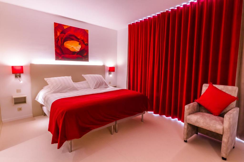 Postel nebo postele na pokoji v ubytování ManavaHotel