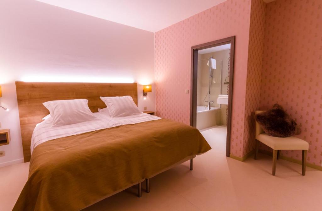 Postel nebo postele na pokoji v ubytování ManavaHotel