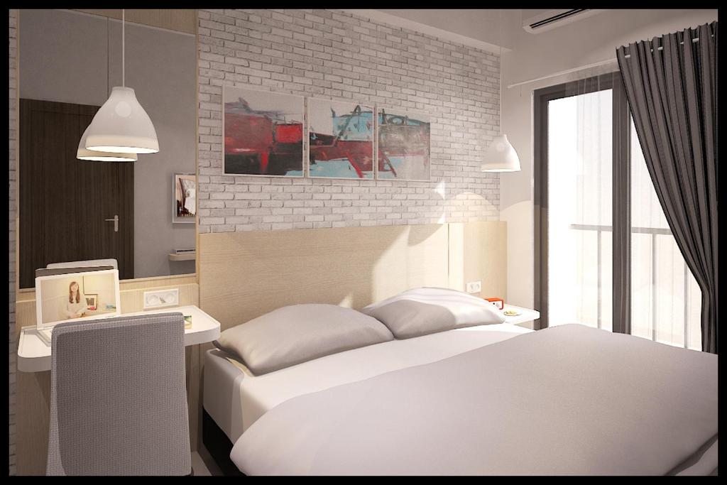 เตียงในห้องที่ Expressia Stay at Serpong Greenview Apartment