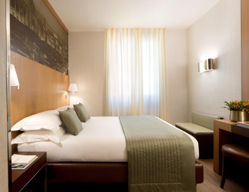Postel nebo postele na pokoji v ubytování Starhotels Ritz
