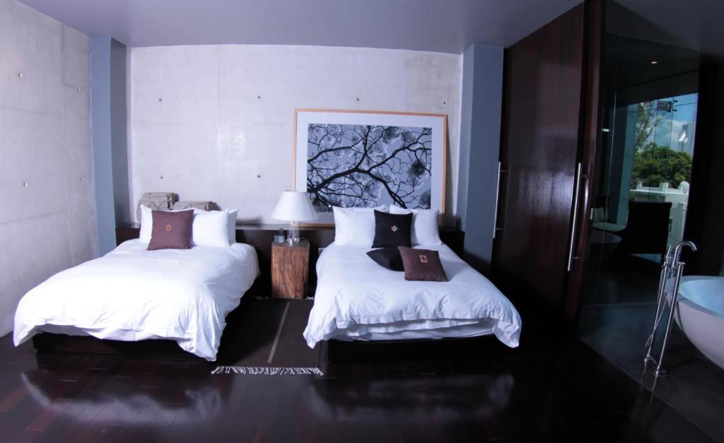 Postel nebo postele na pokoji v ubytování Demetria Hotel