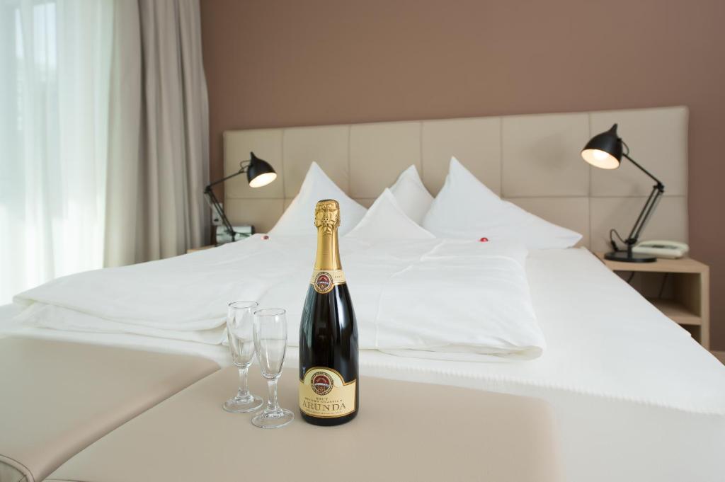 Postel nebo postele na pokoji v ubytování Seeberg Garni Hotel