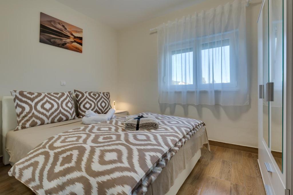 Postel nebo postele na pokoji v ubytování Memories Apartments