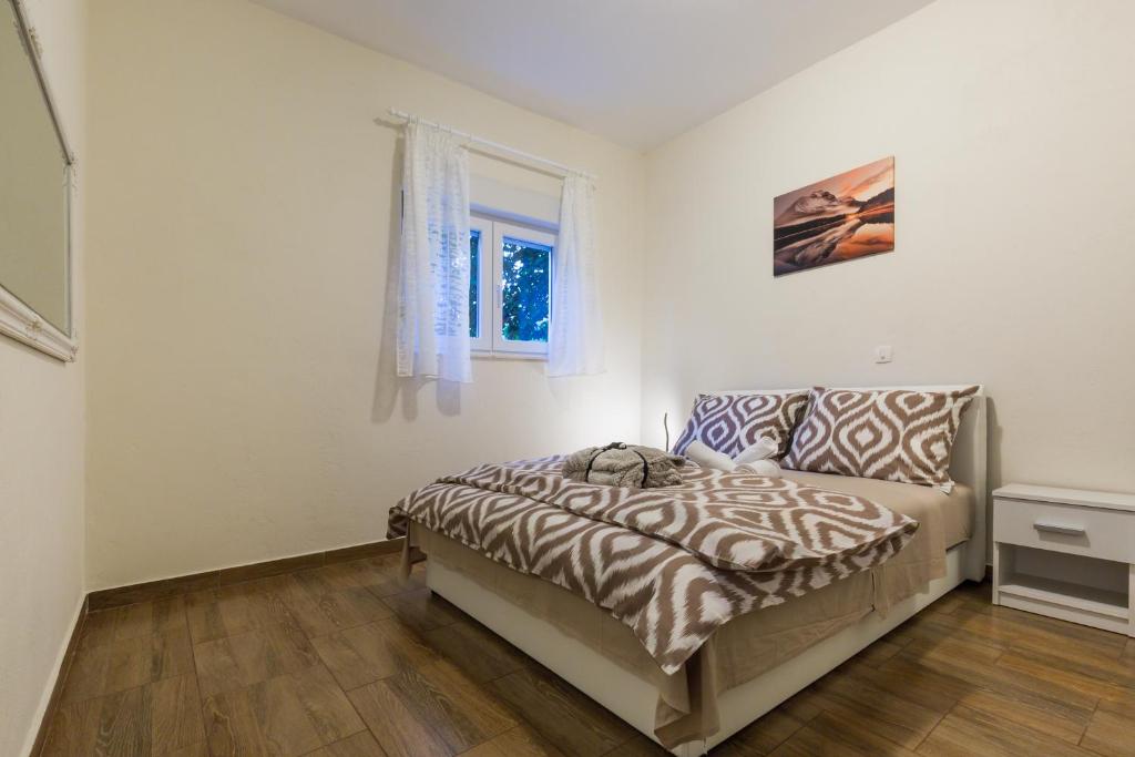 Postel nebo postele na pokoji v ubytování Memories Apartments