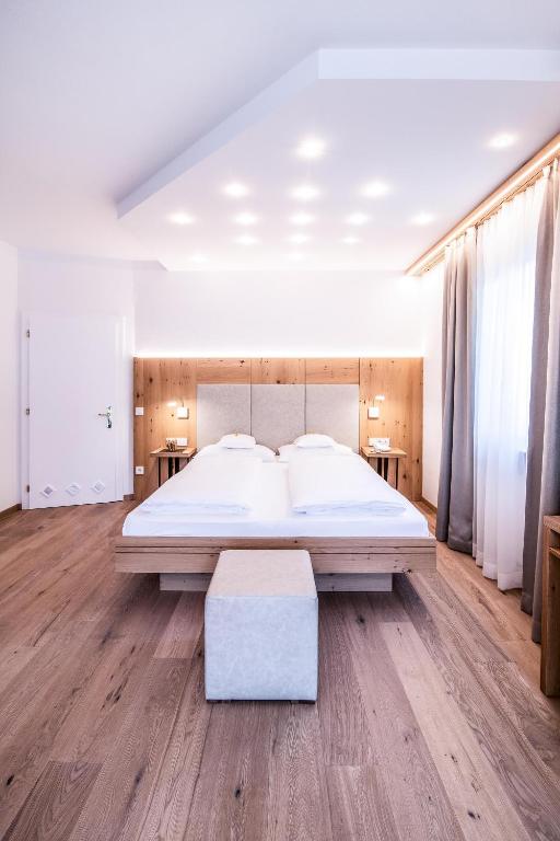 Postel nebo postele na pokoji v ubytování Hotel Residence Rose