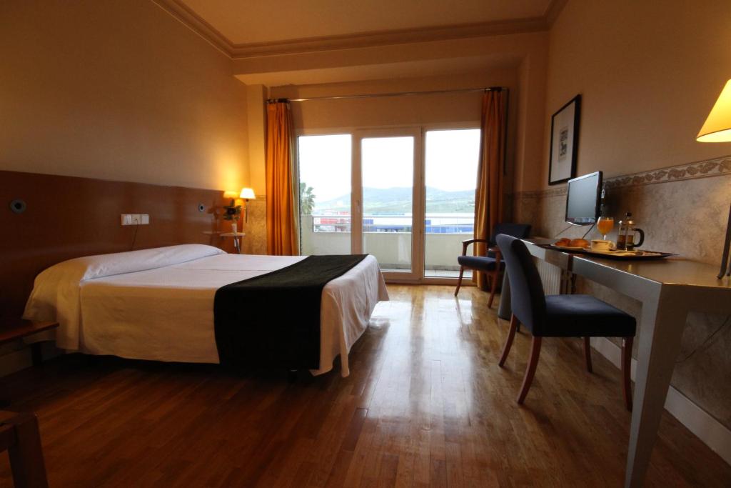 Postel nebo postele na pokoji v ubytování Hotel Azar