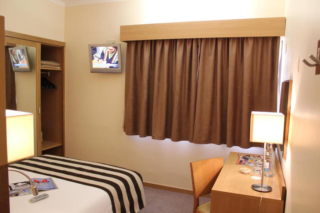 TV a/nebo společenská místnost v ubytování Hotel Principe Lisboa
