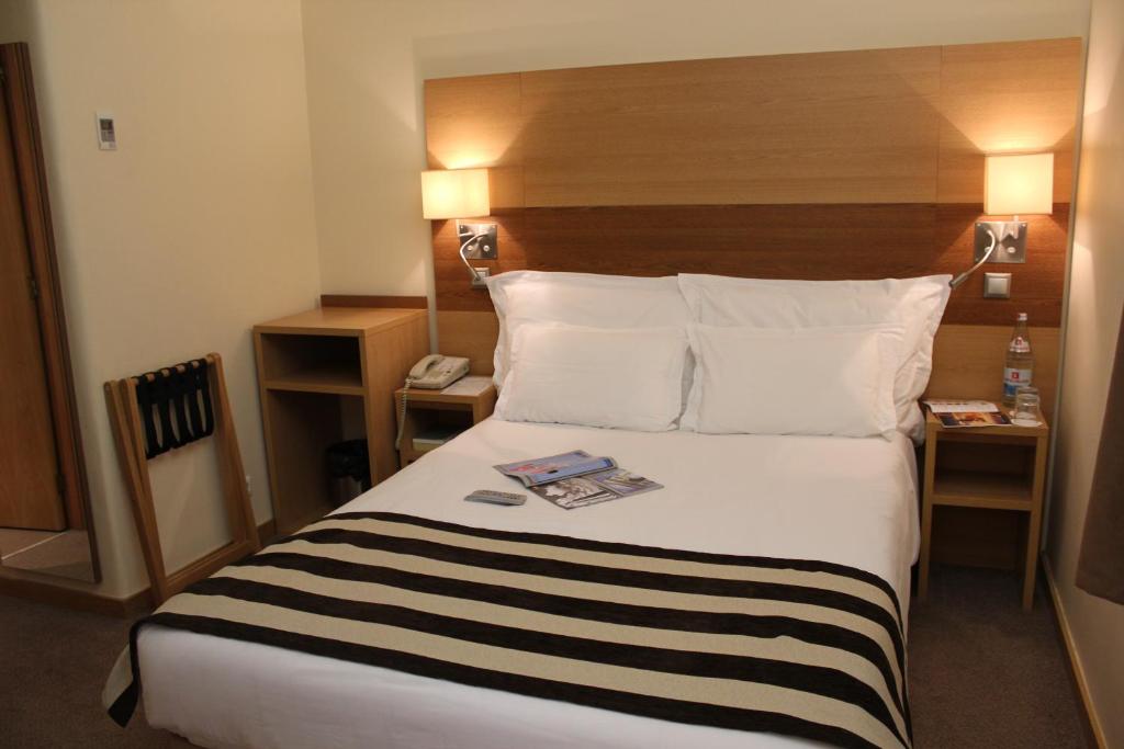 Postel nebo postele na pokoji v ubytování Hotel Principe Lisboa