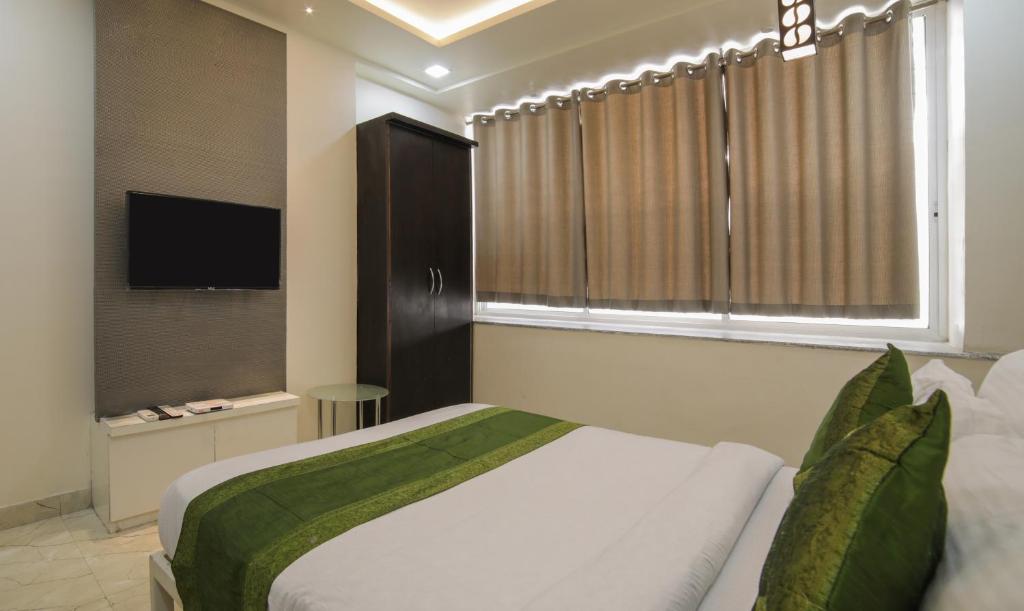 TV a/nebo společenská místnost v ubytování Itsy Hotels Le Clover