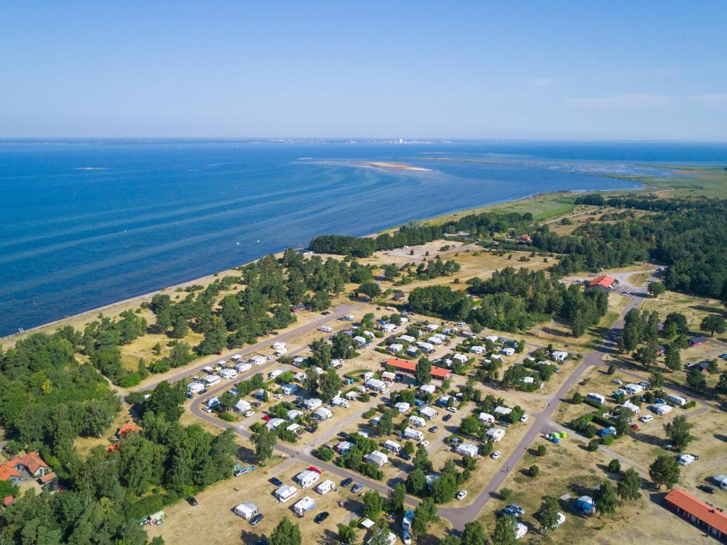 an aerial view of a parking lot next to the water at Haga Park Camping & Stugor in Mörbylånga