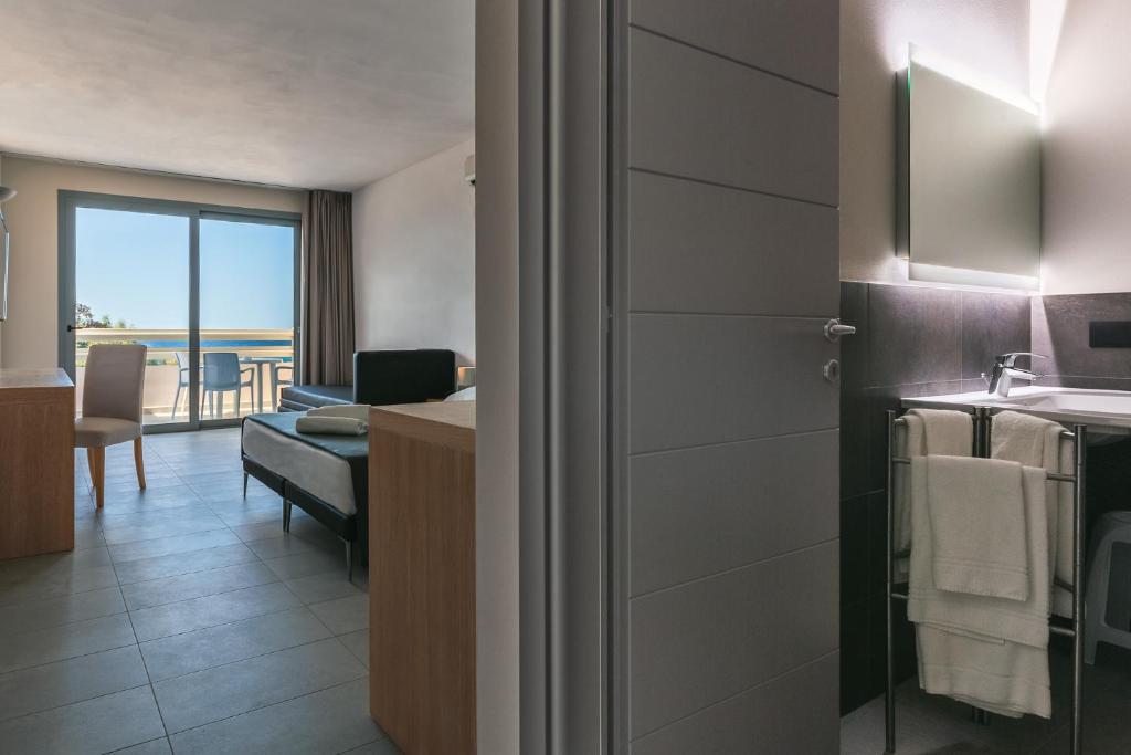 TV a/nebo společenská místnost v ubytování Hotel Delfino