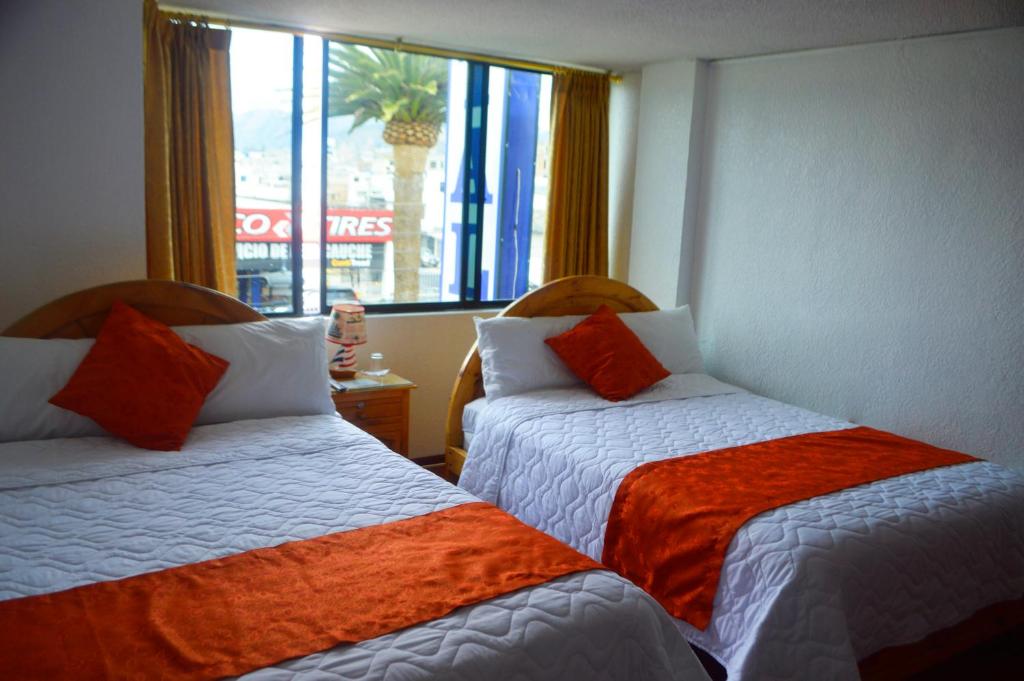 Postel nebo postele na pokoji v ubytování Hostal Alborada Riobamba