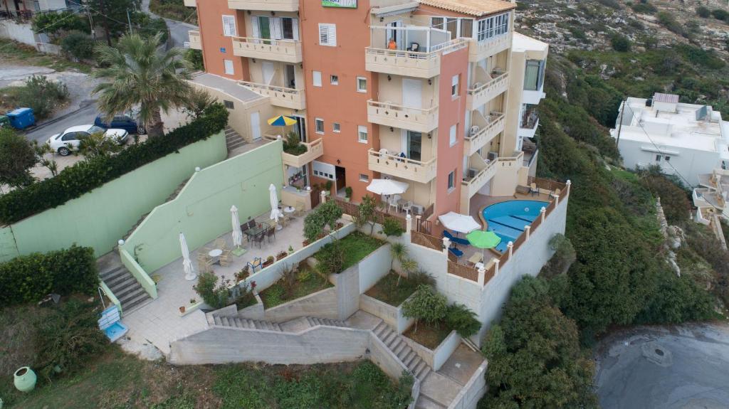 an aerial view of a building with a swimming pool at Eliza Apartments in Rethymno