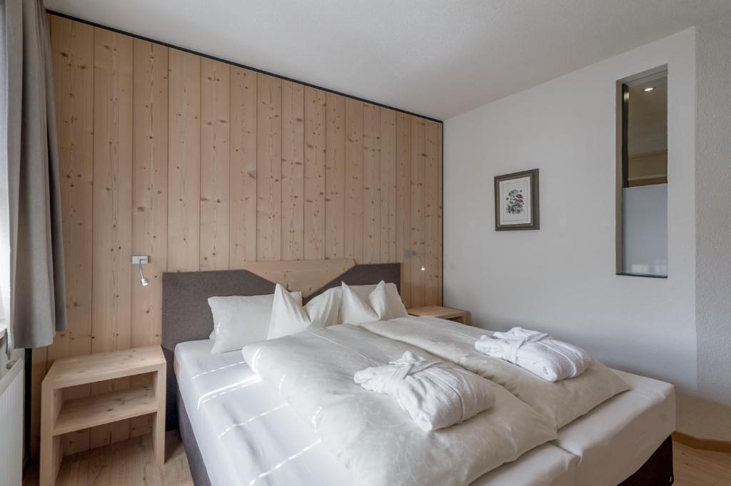 Postel nebo postele na pokoji v ubytování Hotel Garni Pirchhütt