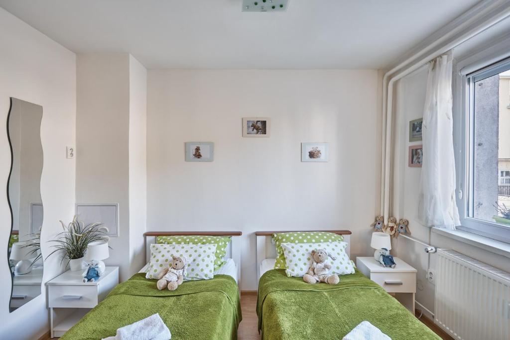 Postel nebo postele na pokoji v ubytování Apartment U Medvídka