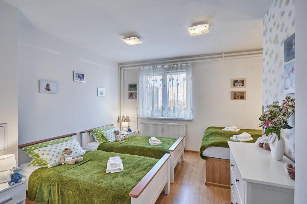 Postel nebo postele na pokoji v ubytování Apartment U Medvídka