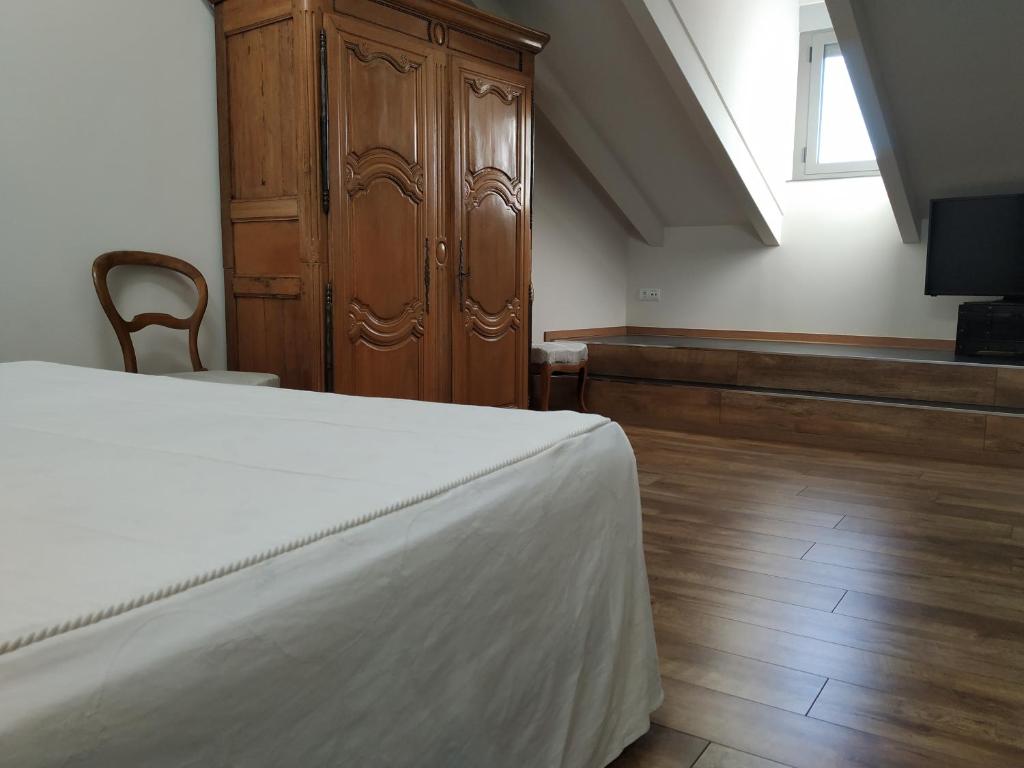 Postel nebo postele na pokoji v ubytování Hostal Siglo XIX