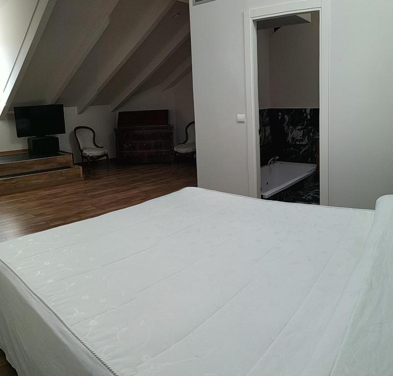 Postel nebo postele na pokoji v ubytování Hostal Siglo XIX
