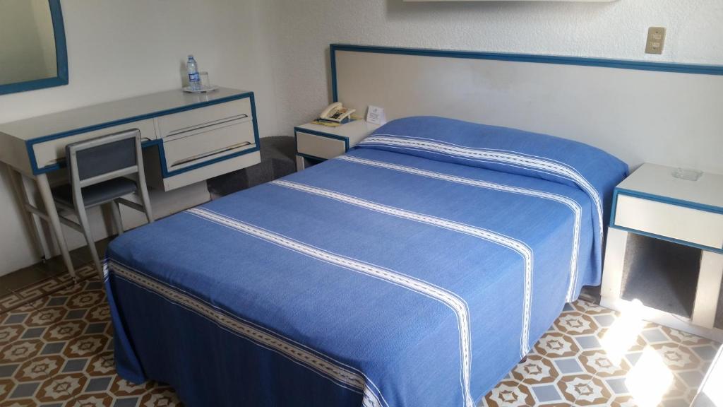 Postel nebo postele na pokoji v ubytování HOTEL OLIDEN