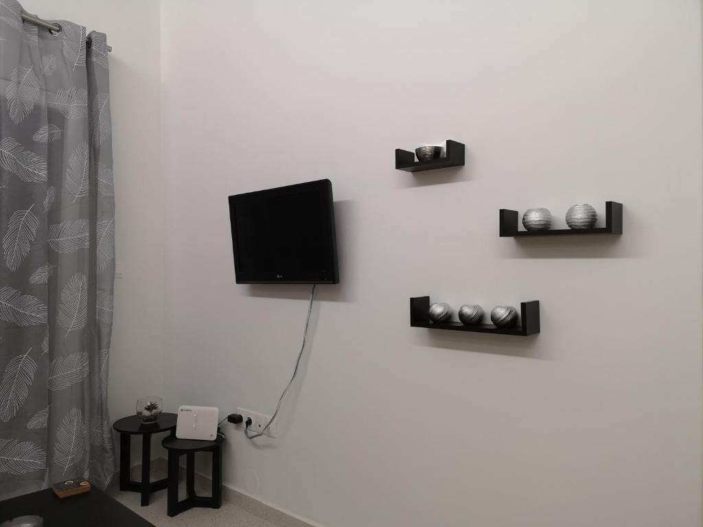 TV a/nebo společenská místnost v ubytování Dimitris House 7