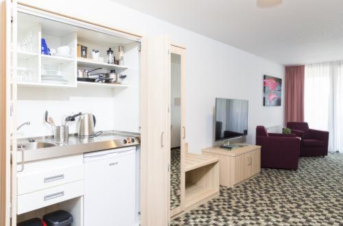 Kuchyň nebo kuchyňský kout v ubytování Hotel Saxenhof