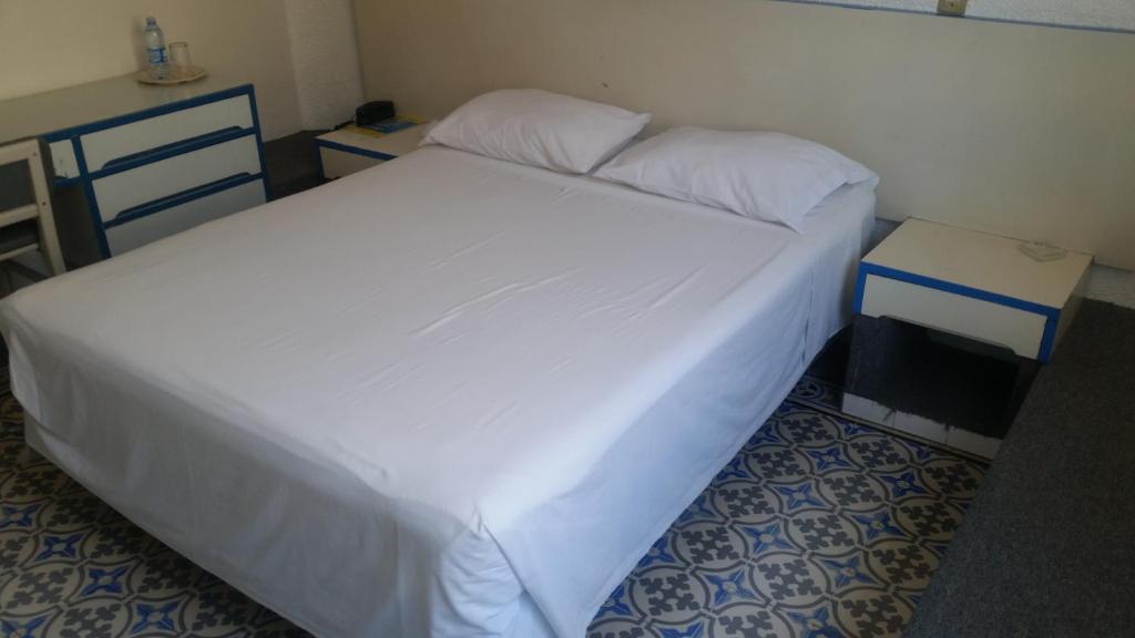 Postel nebo postele na pokoji v ubytování HOTEL OLIDEN