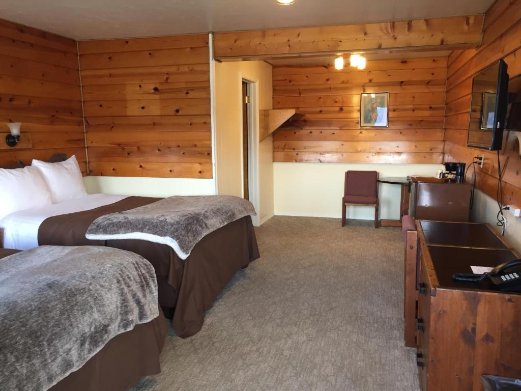 Postel nebo postele na pokoji v ubytování Captain's Choice Motel