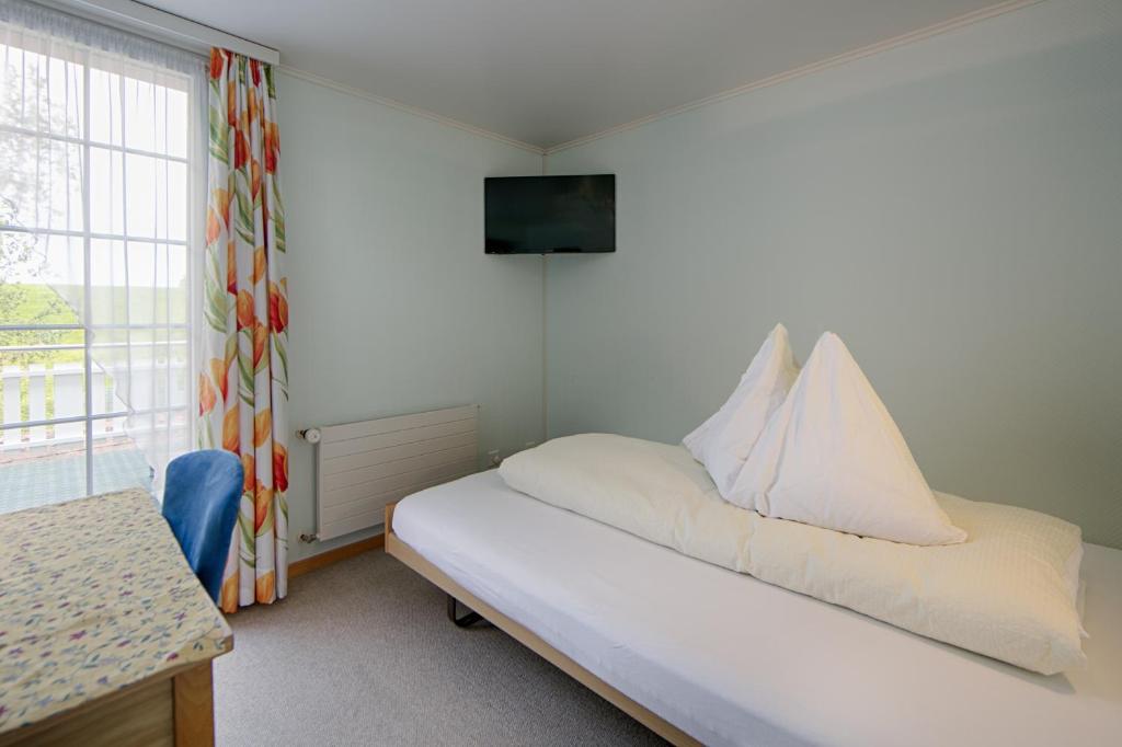 Postel nebo postele na pokoji v ubytování Hotel Frohe Aussicht