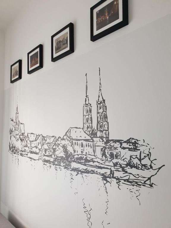 a drawing of a city on a wall at Apartament Nad Starą Odrą in Wrocław
